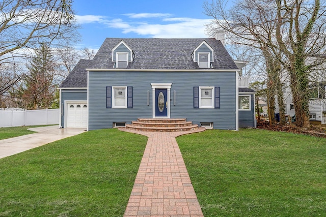view of front of home with roof with shingles, a front yard, a garage, and fence