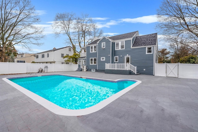 view of pool featuring a fenced backyard, a fenced in pool, a gate, and a patio