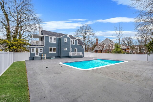 view of swimming pool featuring a fenced backyard, entry steps, a patio area, and a fenced in pool