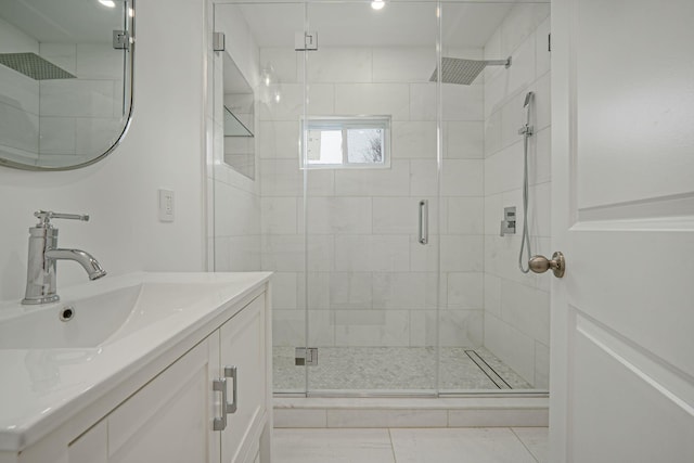 bathroom with vanity and a stall shower
