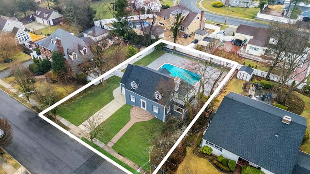 birds eye view of property with a residential view