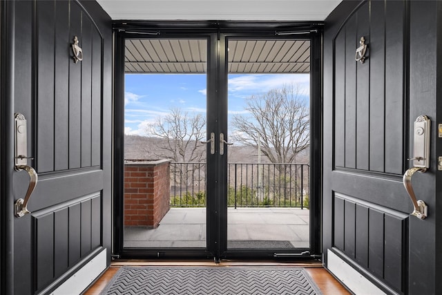 interior space with wood finished floors and french doors
