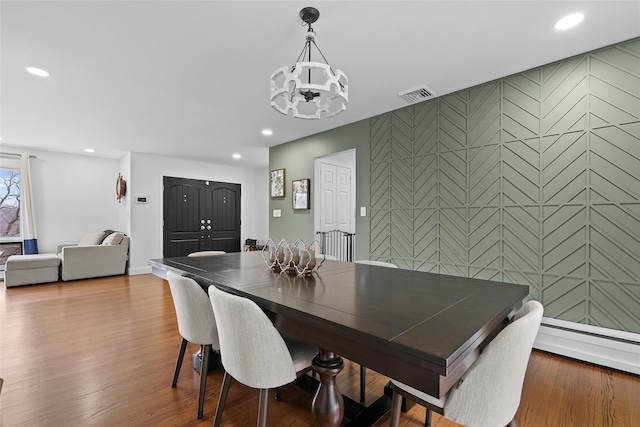 dining area with recessed lighting, visible vents, and a notable chandelier