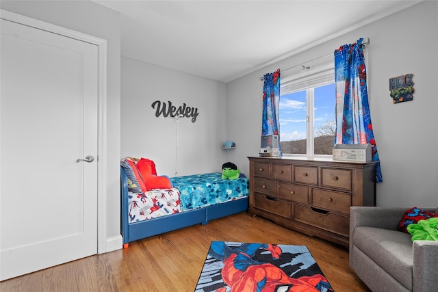 bedroom featuring light wood-style flooring