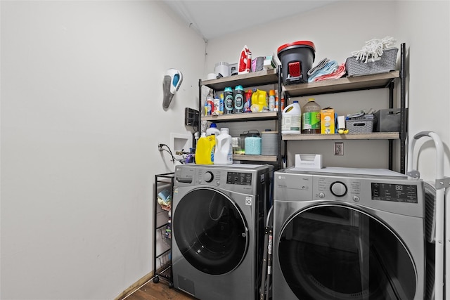 laundry area with wood finished floors, independent washer and dryer, and laundry area