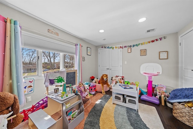 playroom with recessed lighting, visible vents, and wood finished floors