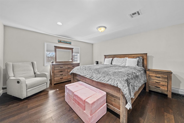 bedroom with dark wood-type flooring, visible vents, recessed lighting, and baseboard heating