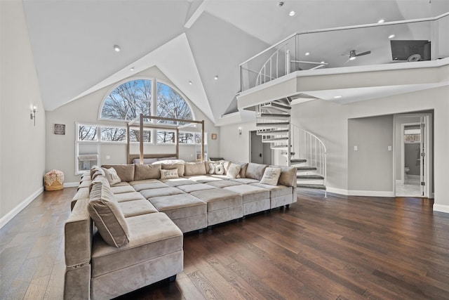 living room featuring high vaulted ceiling, a ceiling fan, wood finished floors, stairs, and baseboards
