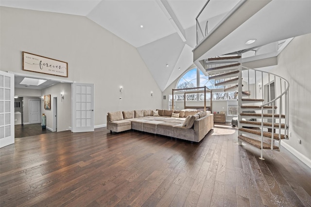 living room featuring high vaulted ceiling, stairs, french doors, wood-type flooring, and baseboards