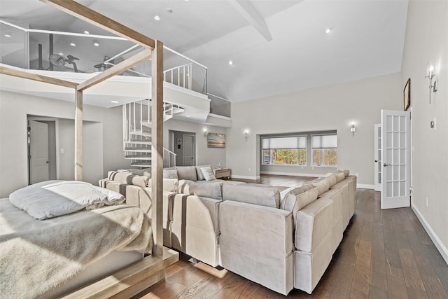 living area featuring baseboards, dark wood-style flooring, stairway, french doors, and high vaulted ceiling