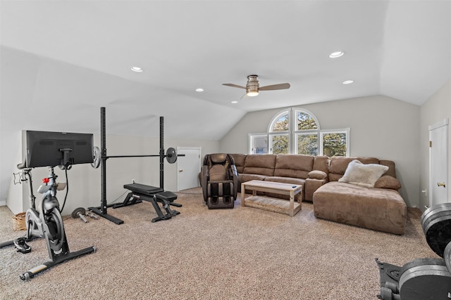 workout area featuring carpet flooring, a ceiling fan, and vaulted ceiling