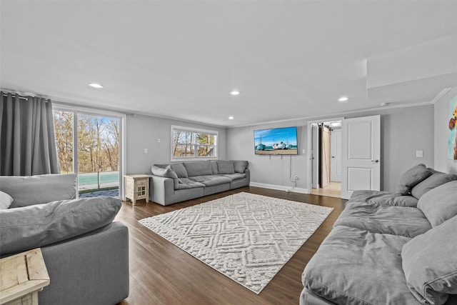 living area featuring dark wood-style flooring, recessed lighting, and crown molding