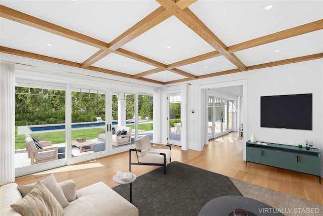 25 Fresh Pond Rd, North Haven, NY 11963 - living room featuring french doors, coffered ceiling, and wood finished floors