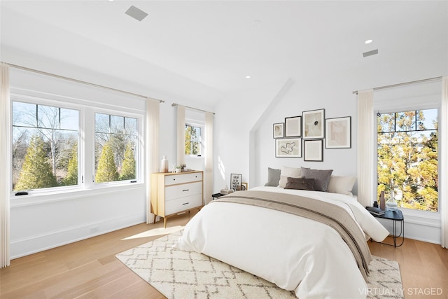 25 Fresh Pond Rd, North Haven, NY 11963 - bedroom with visible vents, baseboards, recessed lighting, and light wood-type flooring