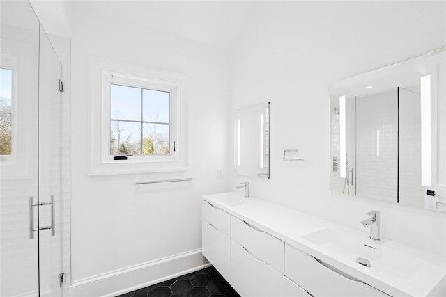 25 Fresh Pond Rd, North Haven, NY 11963 - bathroom featuring a stall shower, baseboards, and a sink