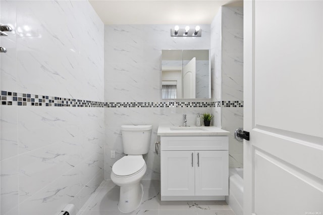 full bathroom featuring marble finish floor, toilet, a shower, and vanity