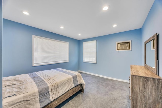 bedroom with carpet floors, baseboards, a wall mounted AC, and recessed lighting