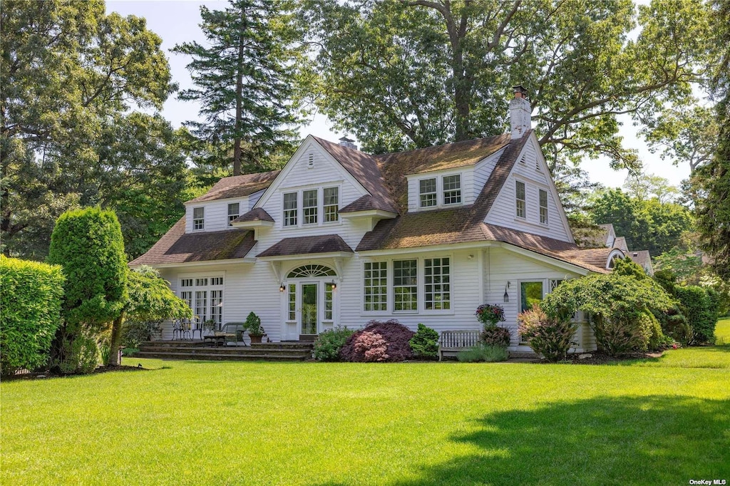 1 Lilac Dr, Stony Brook, NY 11790 - rear view of house with a yard