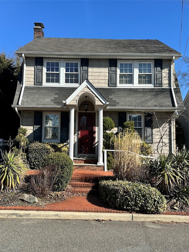 122 Finucane Pl, Woodmere, NY 11598 - traditional-style home featuring a chimney