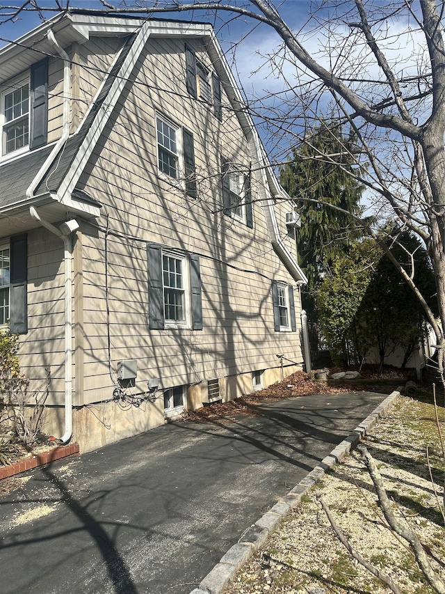 122 Finucane Pl, Woodmere, NY 11598 - view of property exterior with a gambrel roof