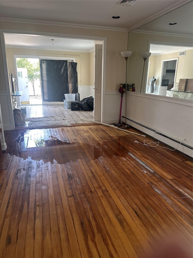 122 Finucane Pl, Woodmere, NY 11598 - unfurnished living room featuring wood-type flooring, visible vents, crown molding, and baseboard heating
