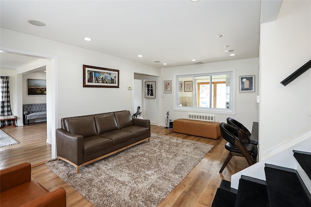 living room featuring visible vents, wood finished floors, and recessed lighting