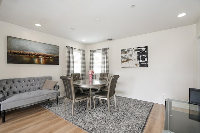 dining area featuring light wood-style flooring, recessed lighting, baseboards, and visible vents