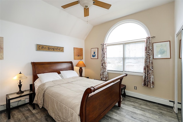 bedroom with lofted ceiling, wood finished floors, and a baseboard radiator