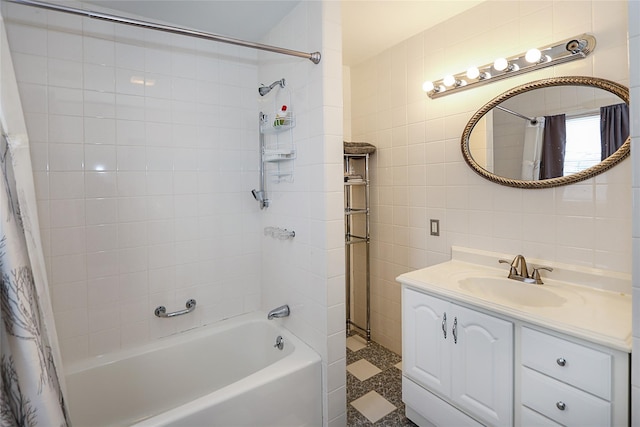 full bath with tile walls, shower / tub combo with curtain, and vanity