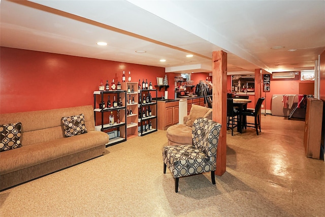 living area with recessed lighting, a wall unit AC, and wet bar