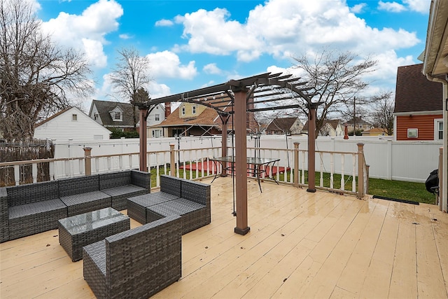 deck featuring a fenced backyard, a residential view, a pergola, and outdoor lounge area
