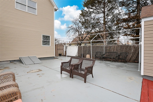 view of patio featuring fence