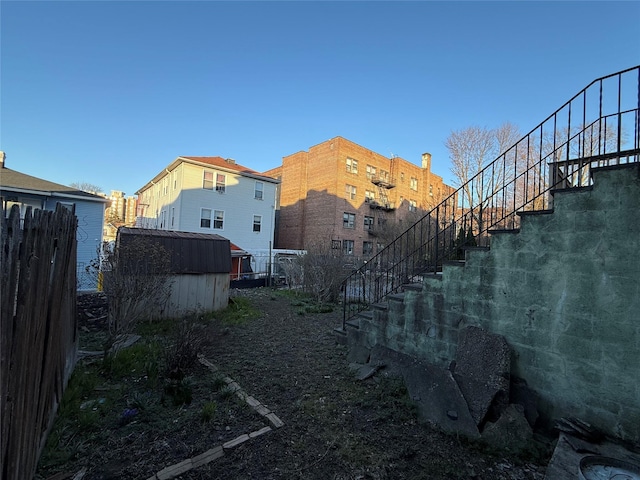39 Rathbun Ave, White Plains, NY 10606 - exterior space featuring an outdoor structure, stairway, a shed, and fence