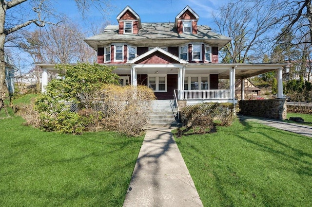 view of front of home featuring covered porch and a front lawn