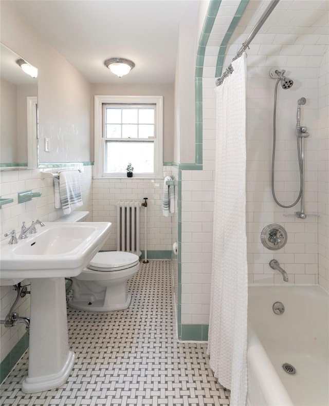 full bath featuring toilet, tile walls, wainscoting, and radiator