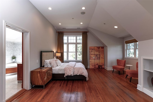 bedroom featuring recessed lighting, baseboards, multiple windows, and hardwood / wood-style floors