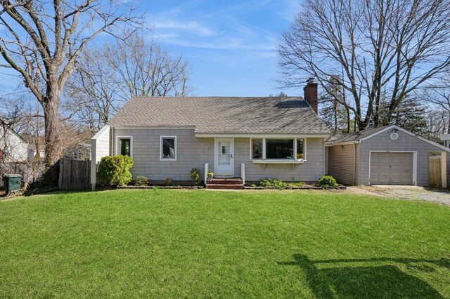 4 Vause St, Northport, NY 11768 - view of front facade featuring a shingled roof, a chimney, fence, an outbuilding, and a front lawn
