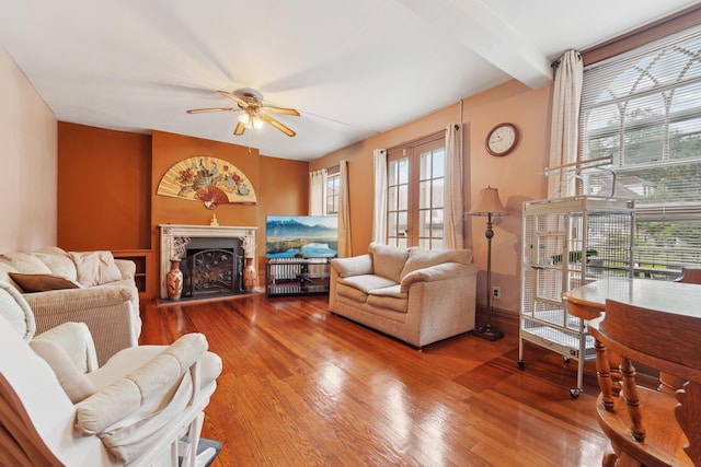227 Valentine Ln, Yonkers, NY 10705 - living area featuring ceiling fan, a fireplace with raised hearth, and wood finished floors