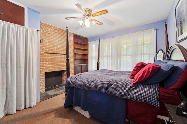 227 Valentine Ln, Yonkers, NY 10705 - carpeted bedroom featuring a brick fireplace and ceiling fan
