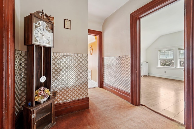 227 Valentine Ln, Yonkers, NY 10705 - corridor featuring radiator heating unit, vaulted ceiling, and carpet