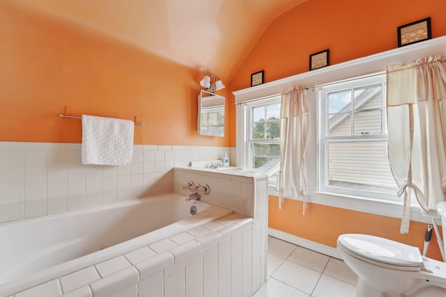 227 Valentine Ln, Yonkers, NY 10705 - bathroom featuring vaulted ceiling, a garden tub, and tile patterned floors