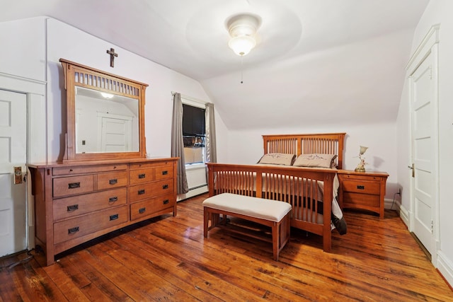 227 Valentine Ln, Yonkers, NY 10705 - bedroom featuring vaulted ceiling, dark wood-style floors, and baseboard heating