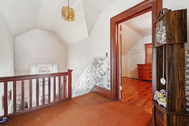 227 Valentine Ln, Yonkers, NY 10705 - hallway with an upstairs landing, vaulted ceiling, and wood finished floors