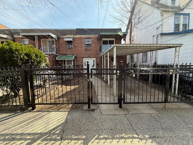 view of gate featuring a fenced front yard