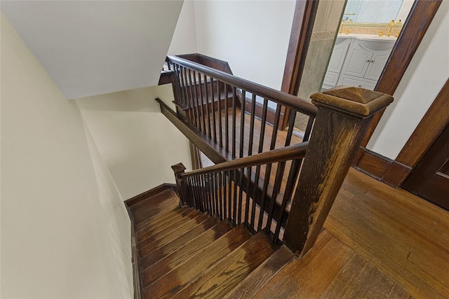 staircase featuring wood-type flooring