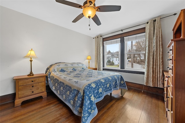 bedroom with baseboards, ceiling fan, and hardwood / wood-style flooring