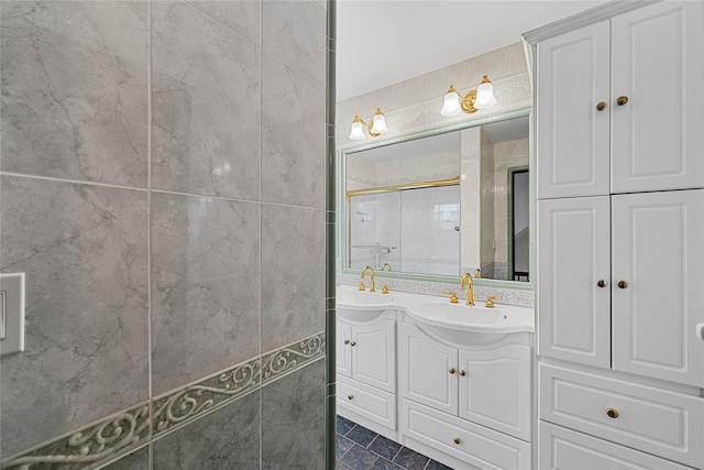 bathroom featuring vanity and a stall shower