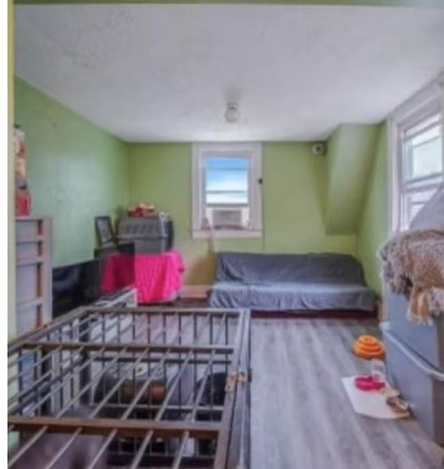 bedroom with wood finished floors