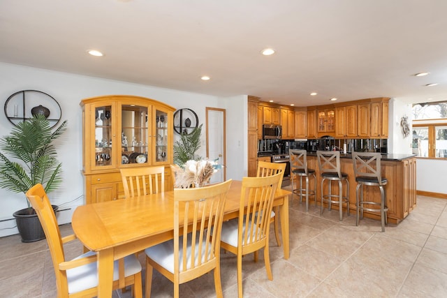 dining space featuring recessed lighting