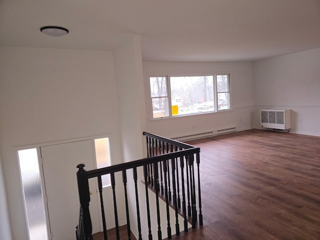 51 Glenerie Ln, Saugerties, NY 12477 - stairway featuring baseboard heating, wood finished floors, and radiator heating unit